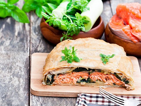 Salmon  fillet on leek and spinachbaked in puff pastry with vegetables